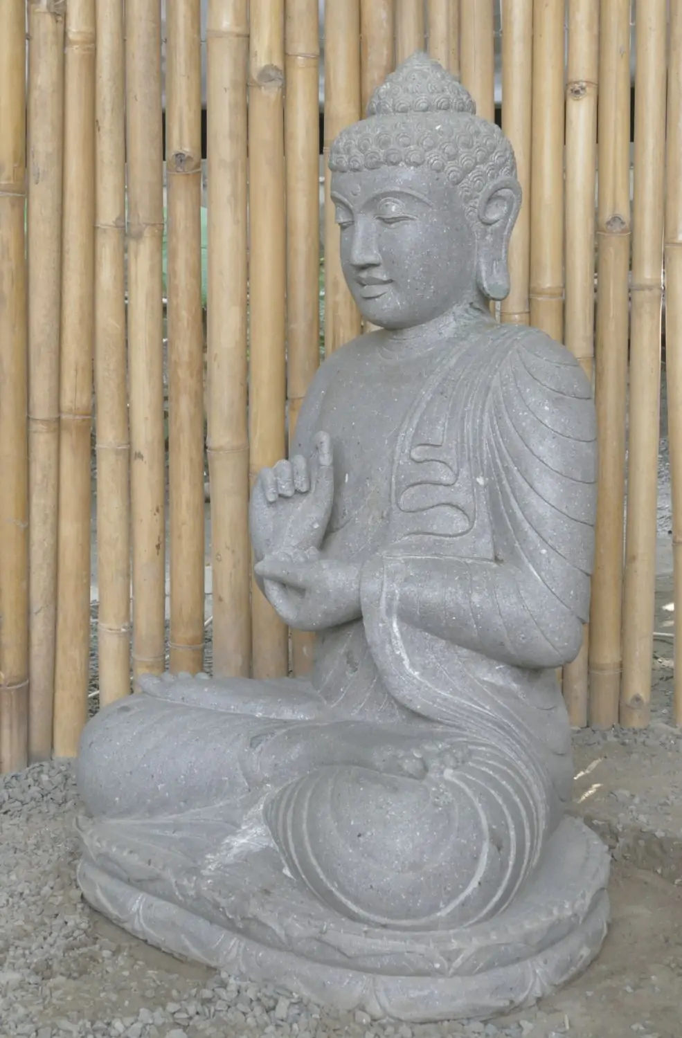  Product image 7 of the product “Seated Buddha made of Riverstone in Dharmachakra gesture of wheel of the teaching of the Dharma, H. 83cm. There is a stone eye on the left shoulder. ”